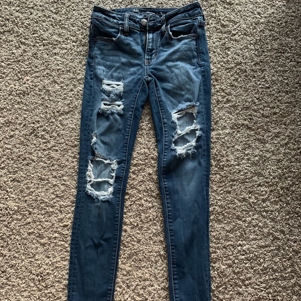 blue ripped jeans